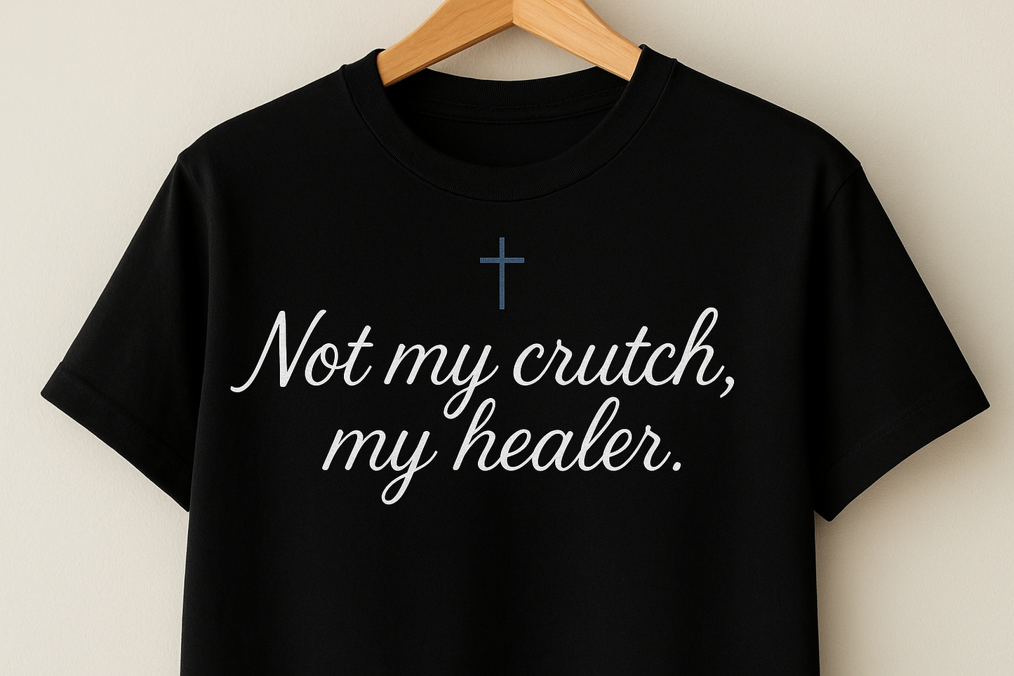 Black shirt with blue cross and text with comma